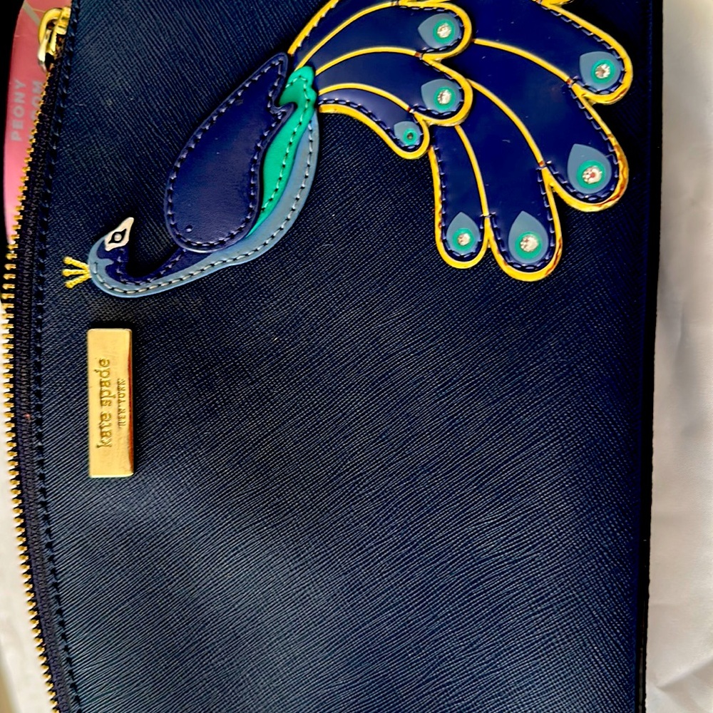 Peacock features Kate Spade New Your purse.Good condition reasonable price.